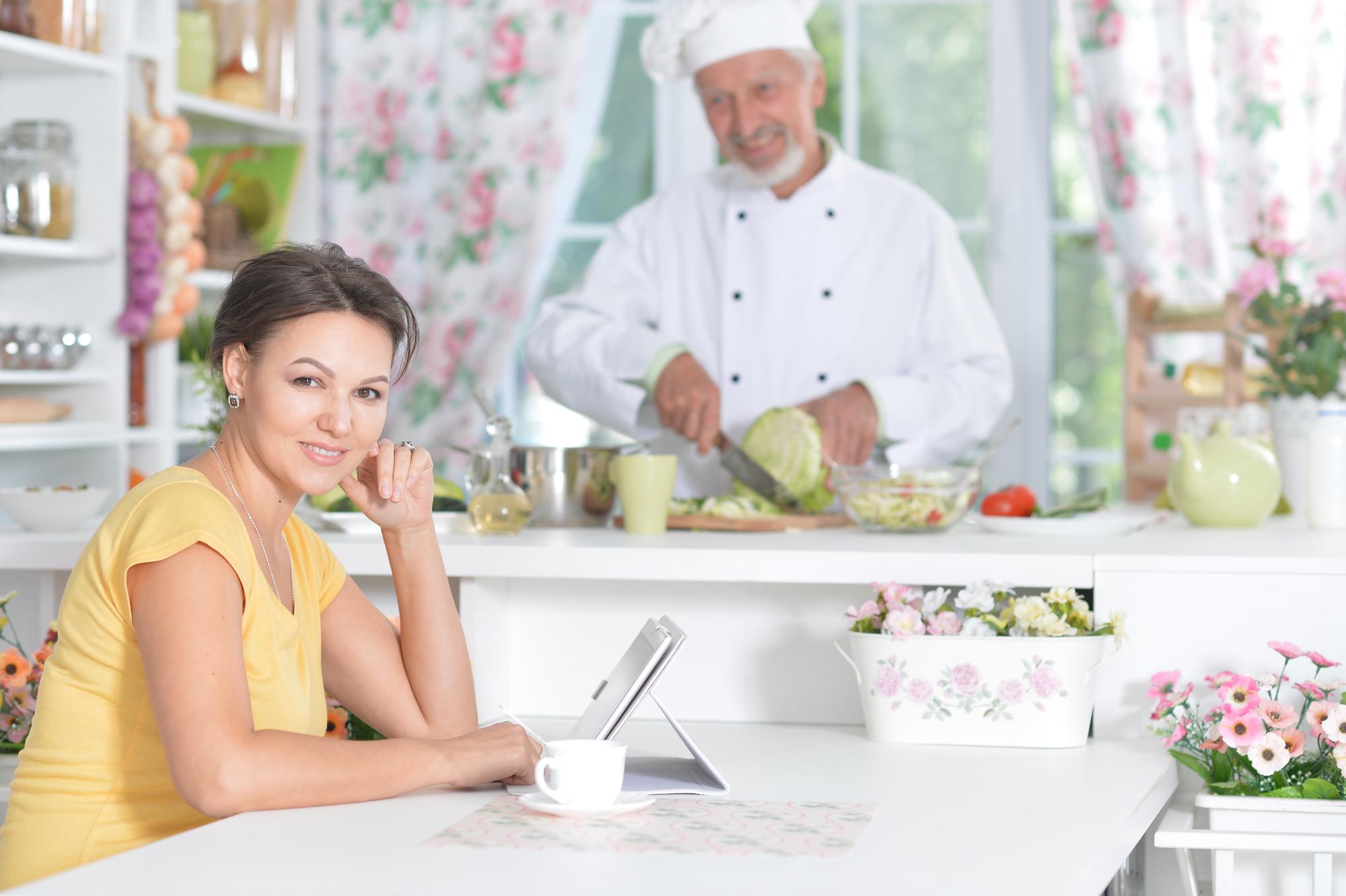 Bright kitchen studio with chef at bench